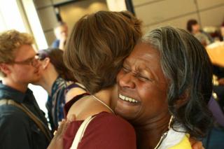 Supportive hugs are exchanged at the Tennessee Valley UU Church in Knoxville, TN